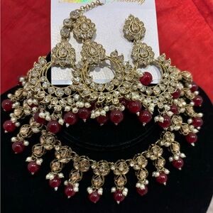 Beautiful necklace set with earrings and tikka set in reverse AD stones.